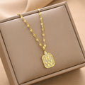 Women's gold-tone tag charm necklace with rectangular pendant and HW letters
