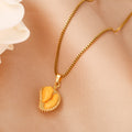 Gold-tone pendant necklace with open durian pod charm and resin segments