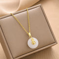 Gold chain pendant necklace with round white lucky ring charm