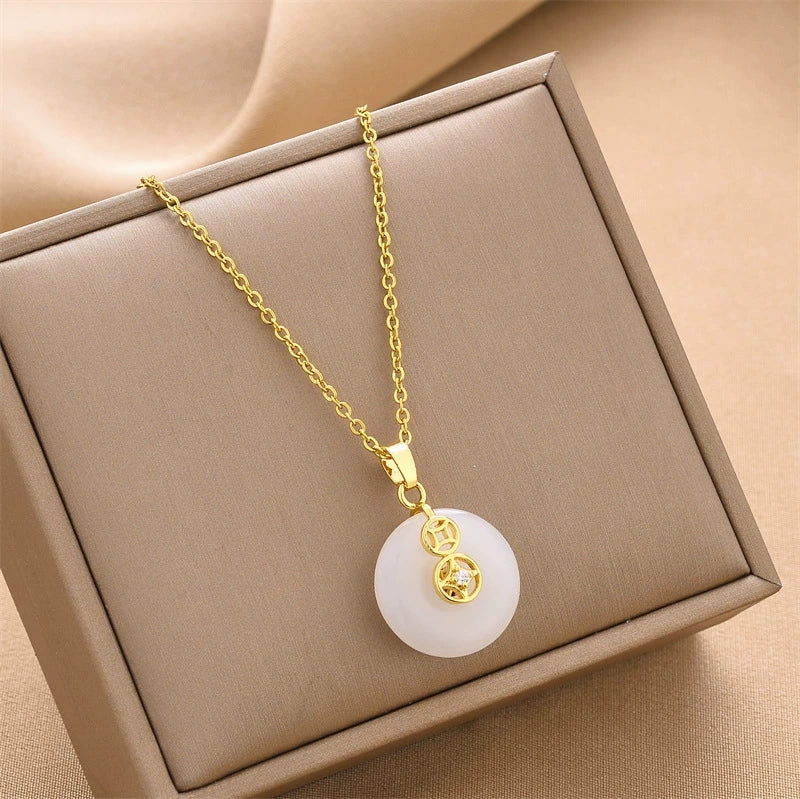 Gold chain pendant necklace with round white lucky ring charm