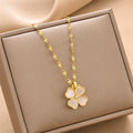 Gold flower pendant necklace with small crystal accent on link chain