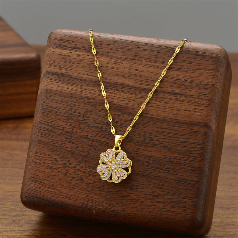 Gold-tone flower pendant necklace with petal floral charm on link chain
