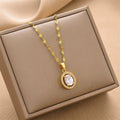 Gold-tone chain necklace with round halo gemstone pendant