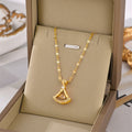 Gold-tone petal pendant necklace with teardrop charm and clear stone detailing.