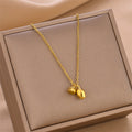 Gold-tone lotus root pendant necklace with linked chain