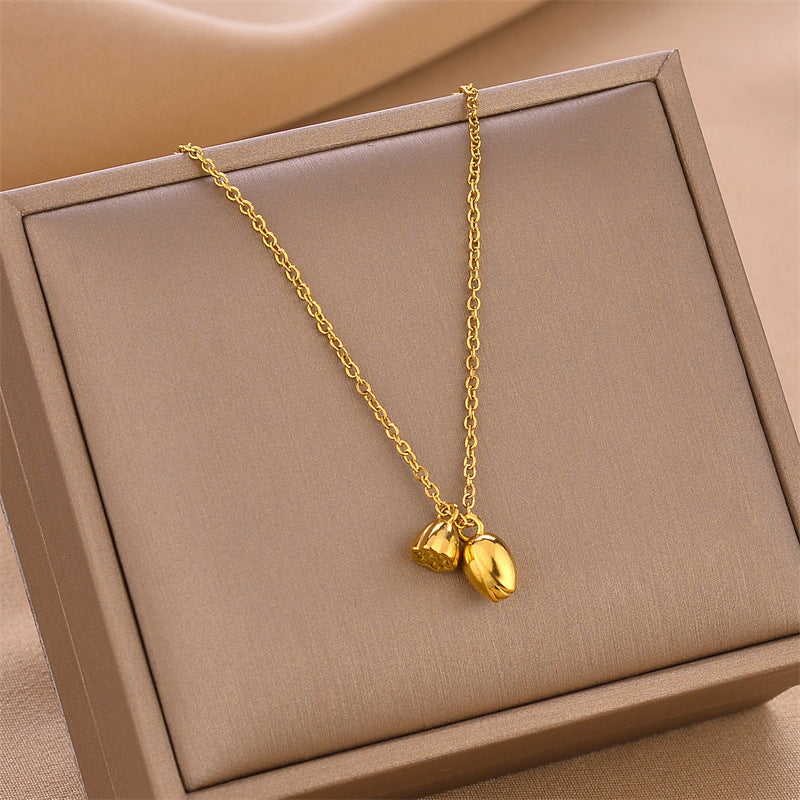 Gold-tone lotus root pendant necklace with linked chain