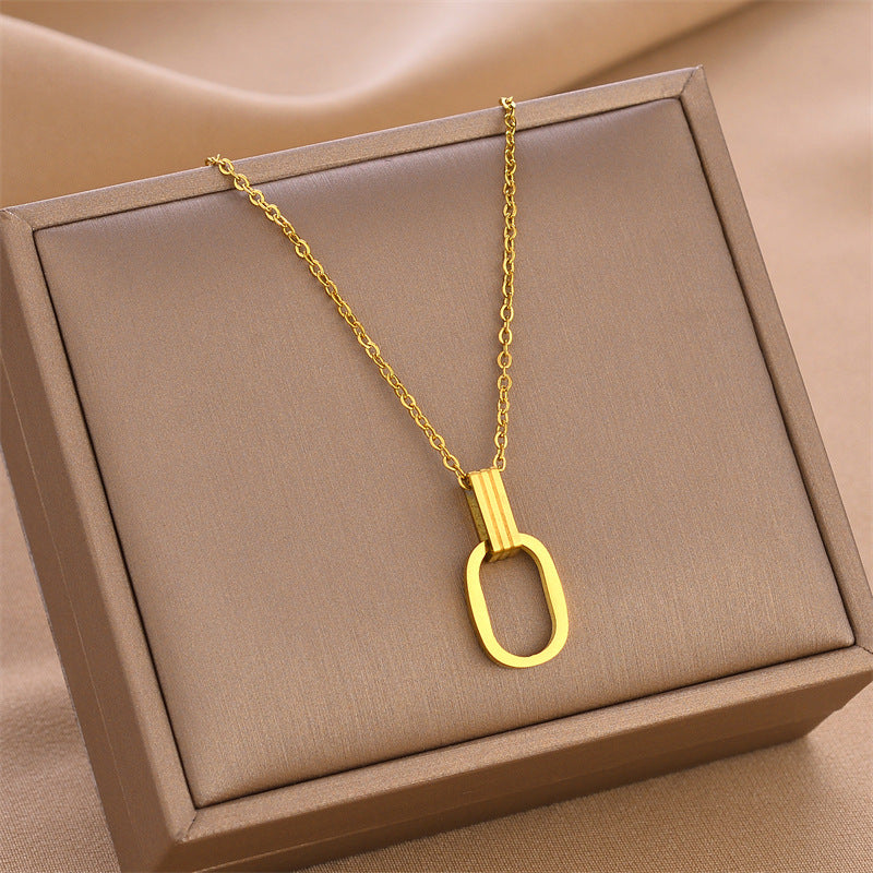 Gold O-shaped charm necklace with linked chain and oval open ring pendant