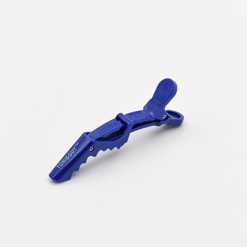 Blue duckbill hair sectioning clip with textured grip pads