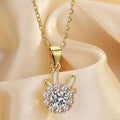 Gold-tone chain necklace with teardrop bail and round crystal flower pendant