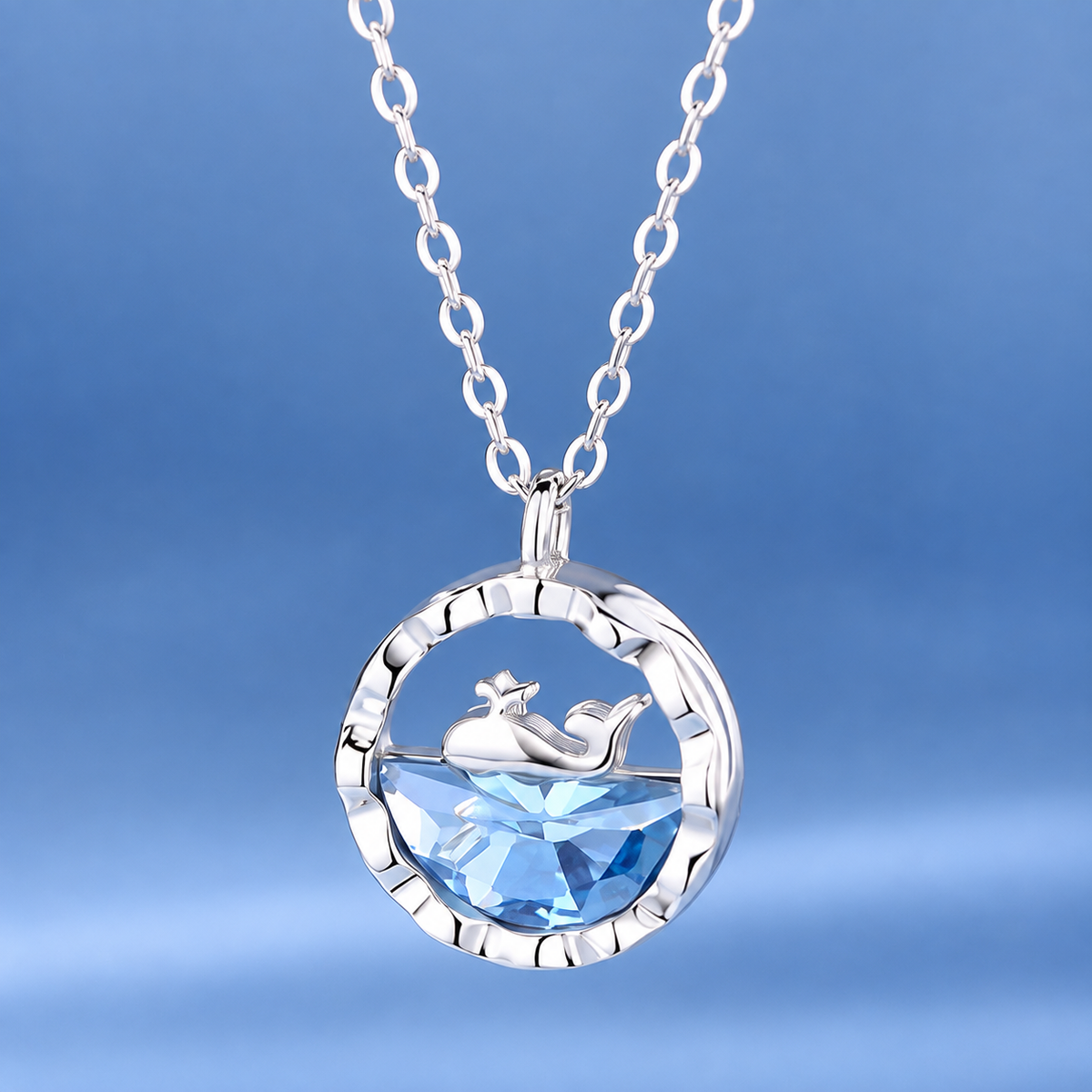Silver shark ocean pendant necklace with large round blue crystal and shark motif
