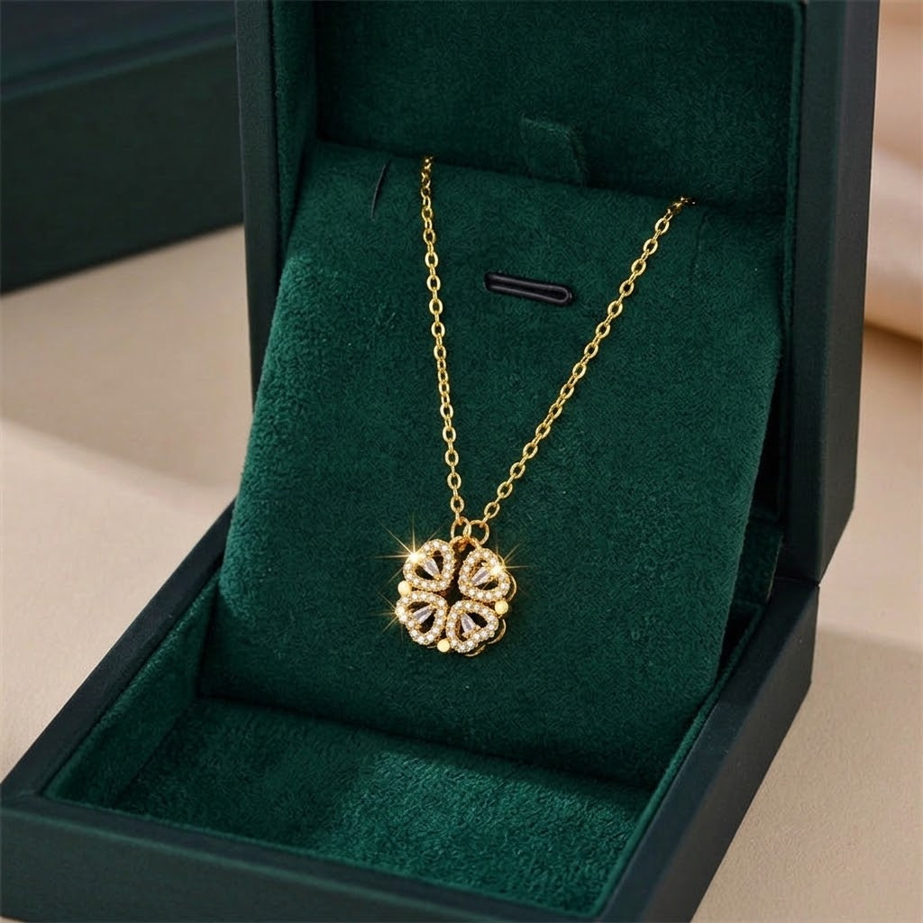Gold clover pendant necklace with faceted stones on a delicate chain
