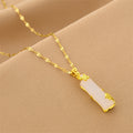 Gold chain necklace with white rectangular segment pendant, ornate gold ends