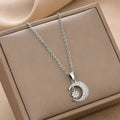 Crescent moon and star charm necklace with silver-tone chain and pendant