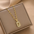 Gold-tone number 7 charm necklace with glittery rhinestone pendant