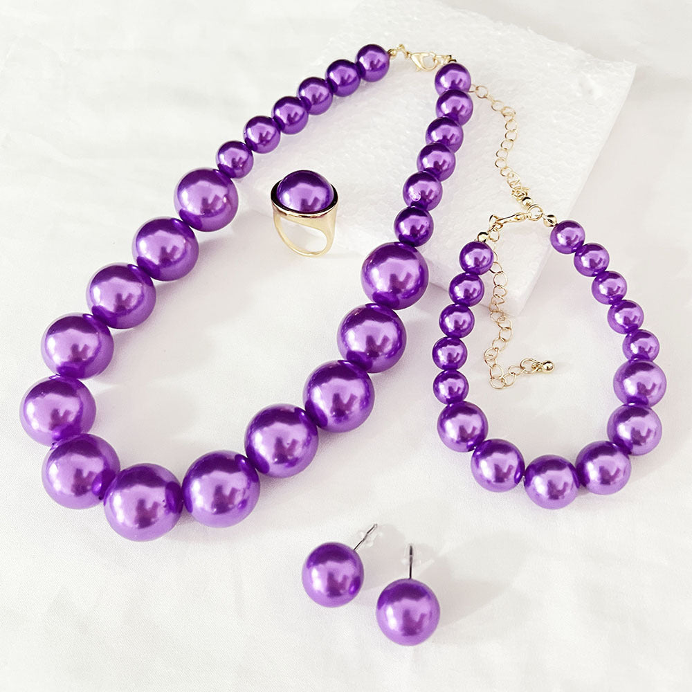Purple faux pearl jewelry set with beaded necklace, bracelet, earrings, and ring