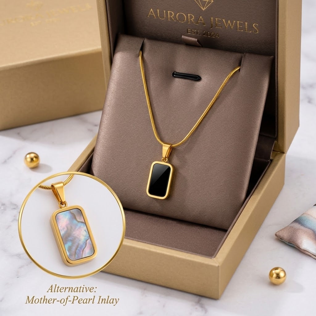 Gold square charm necklace with black enamel pendant and iridescent mother-of-pearl charm shown