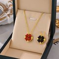 Flower pendant necklaces with gold chains, red and black clover-style charms