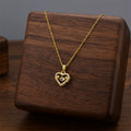 Gold mini heart pendant necklace with small heart charm on chain