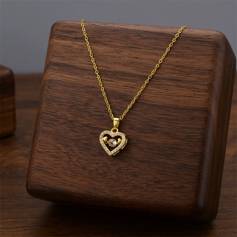Gold mini heart pendant necklace with small heart charm on chain
