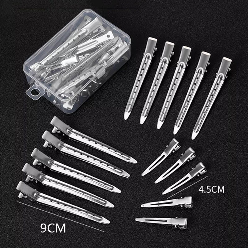 Silver duckbill hair sectioning clips in clear plastic box, spring hinged design