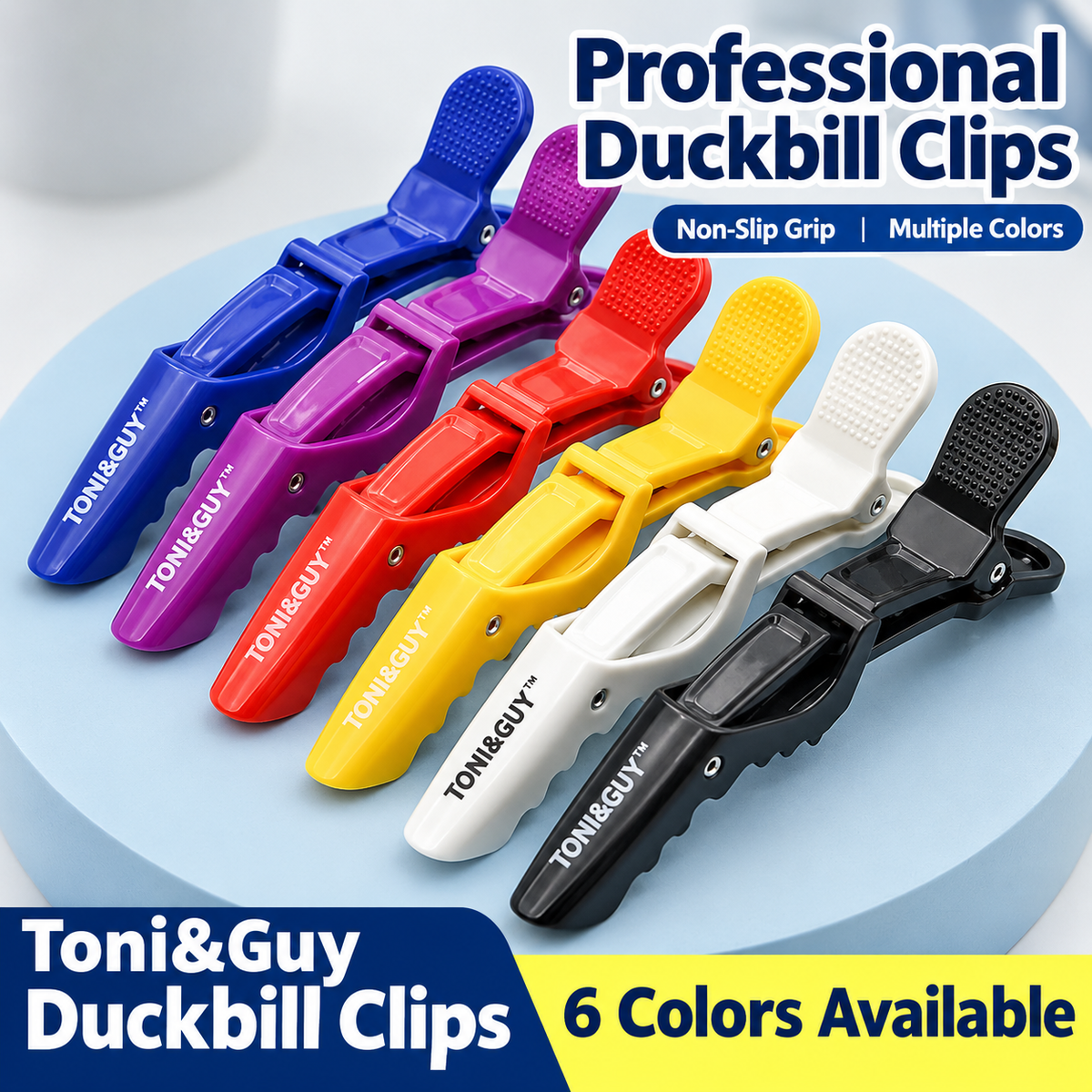 Duckbill hair sectioning clips in six colors displayed on a round tray