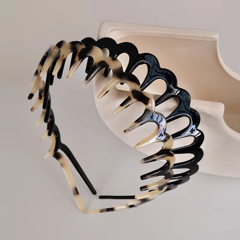 Wave hair comb headbands in amber, black, and light beige tortoiseshell tones