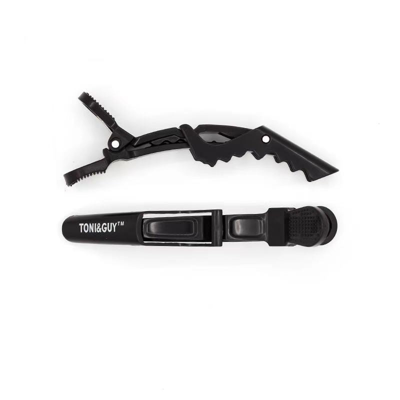 Black duckbill hair sectioning clip shown with a back-side view