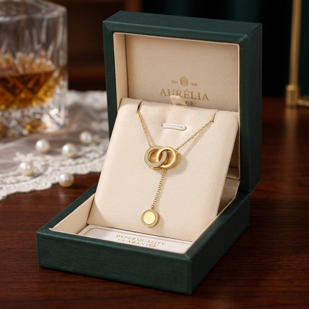 Gold-tone cylinder and ring pendant necklace in green gift box, circular ring charm pendant