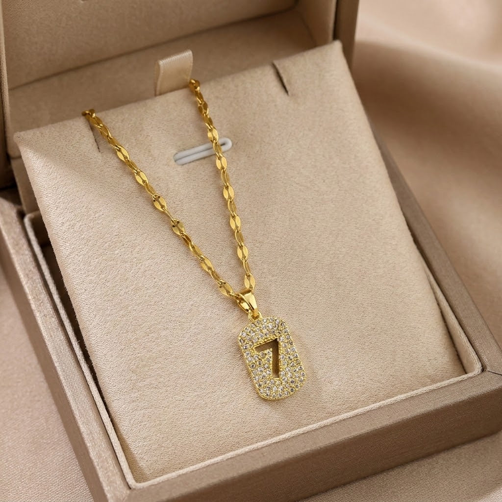 Gold-tone number 7 charm necklace with sparkling pendant on link chain