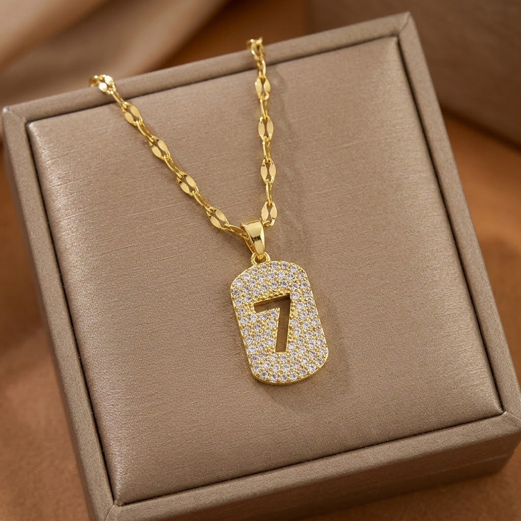 Gold-tone number 7 charm necklace, glittery pendant on flat link chain