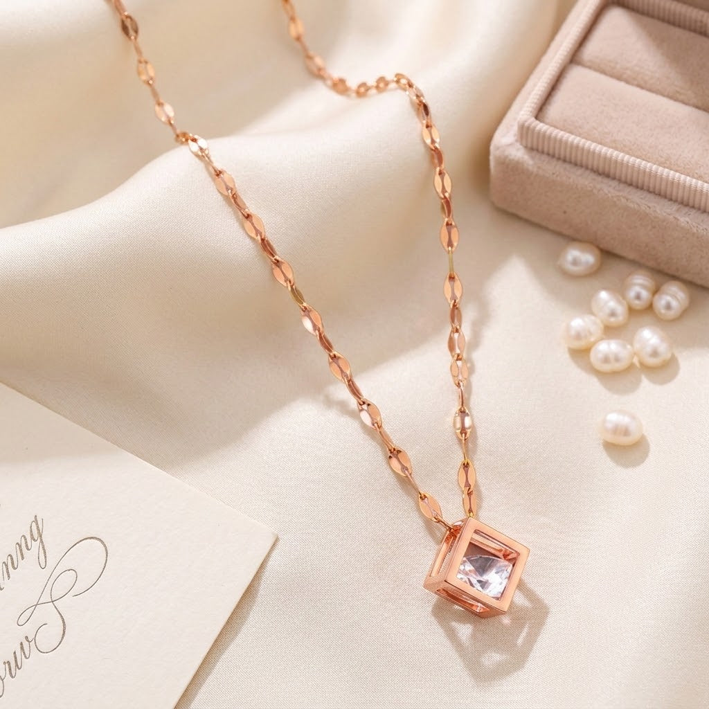 Rose gold square charm necklace with pink cubic pendant on long flat link chain