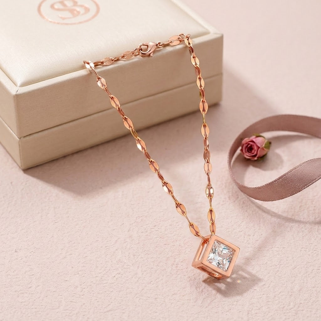 Rose gold square charm necklace with pink cubic pendant and flat link chain