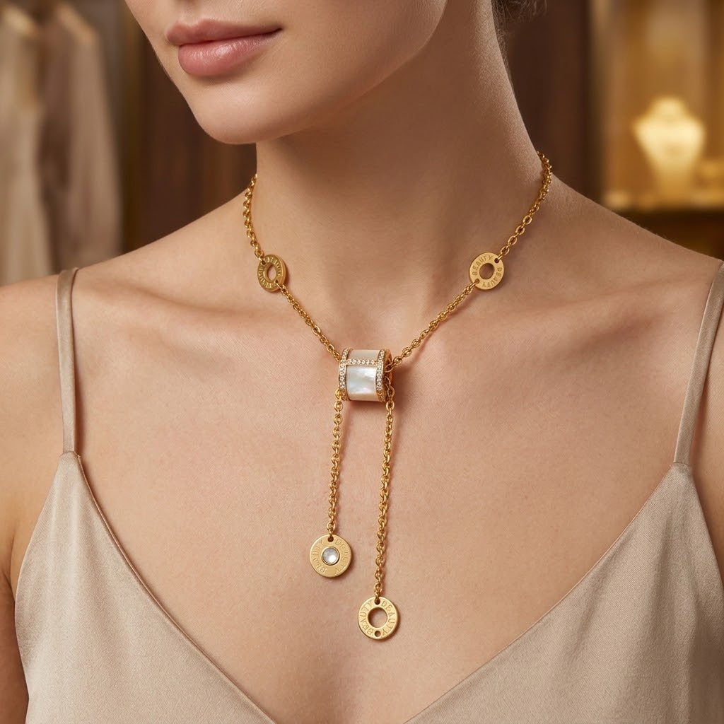 Gold-tone triple ring crystal charm necklace worn with round disc charm pendants
