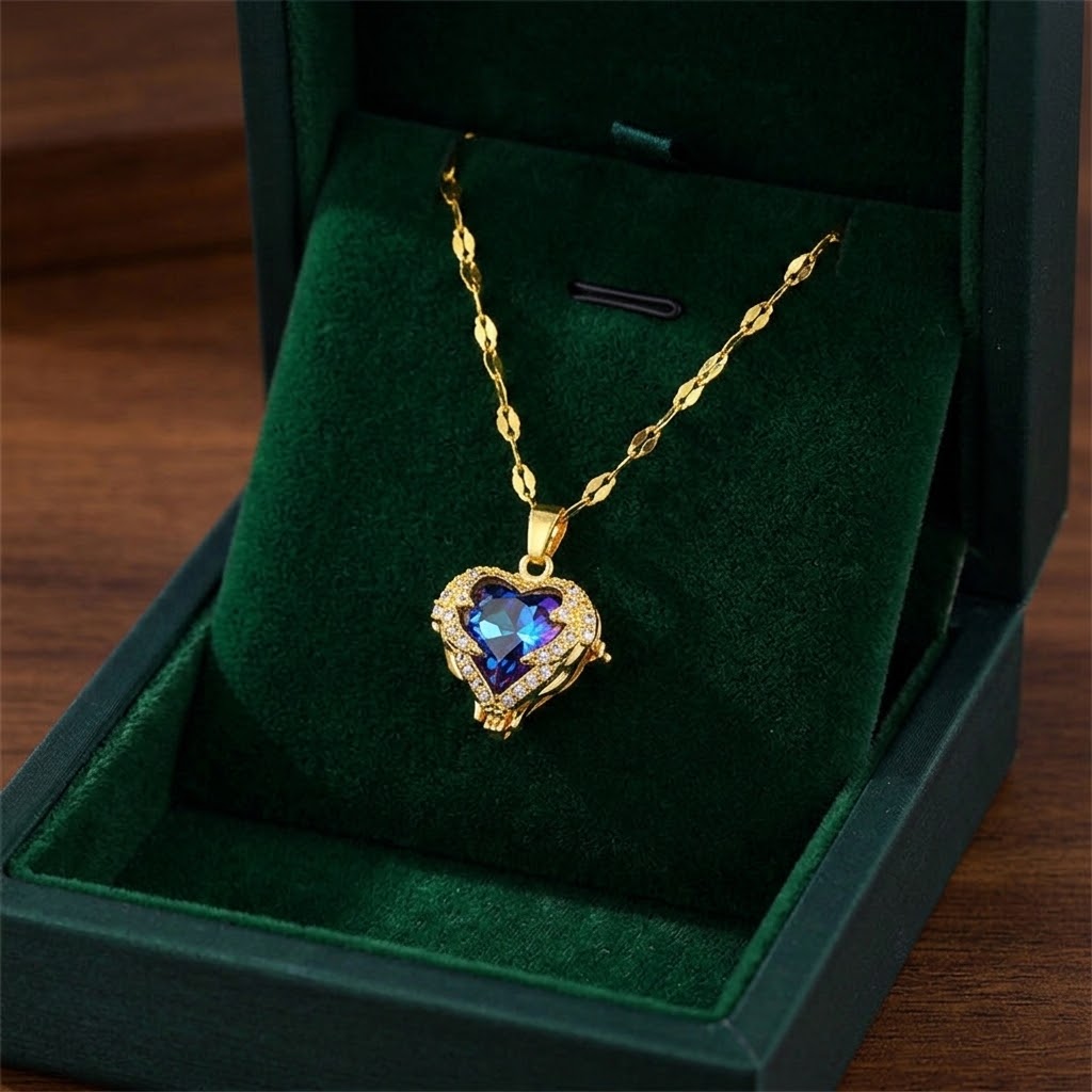Gold heart halo pendant necklace with blue-purple gemstone and clear crystal detail