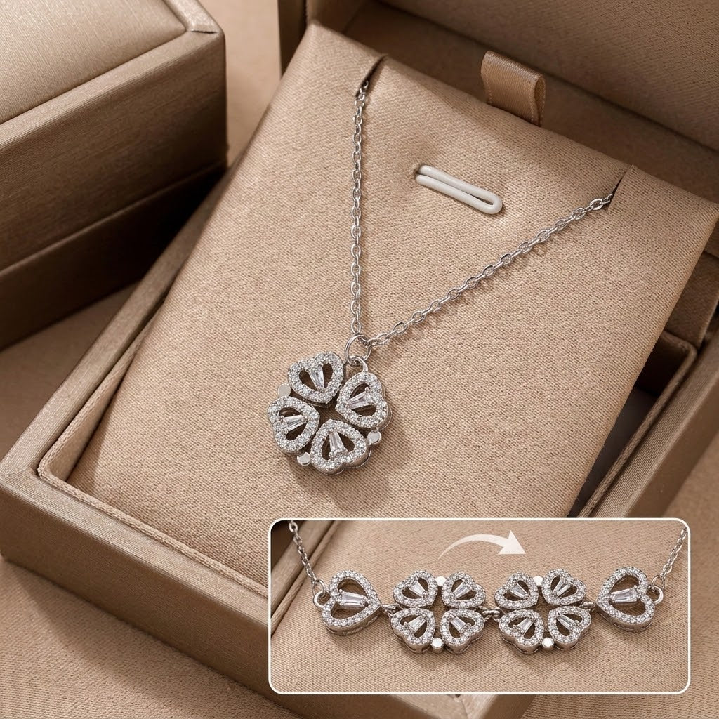 Silver-tone clover pendant necklace with three heart-shaped gemstone elements
