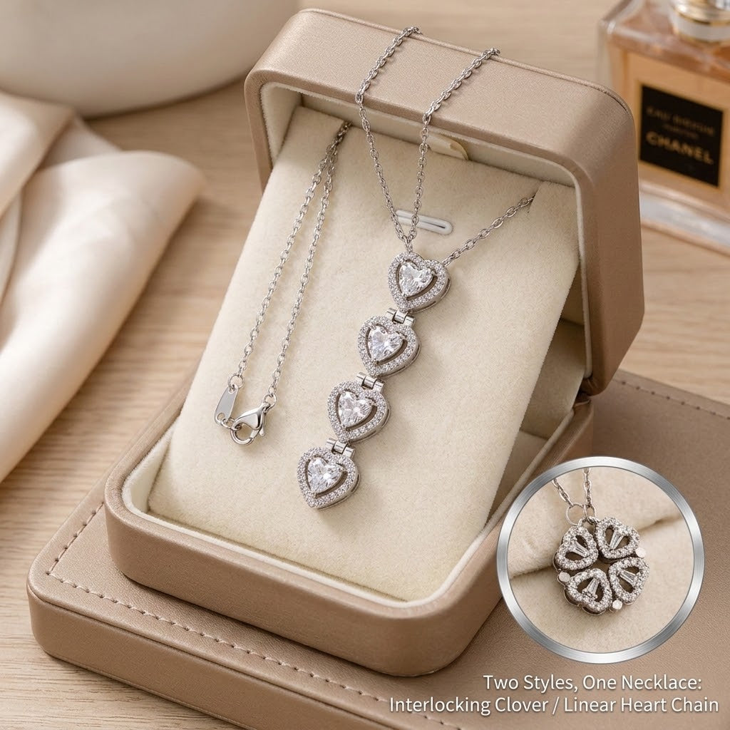 Silver-tone heart link pendant necklace with interlocking clover-style charms