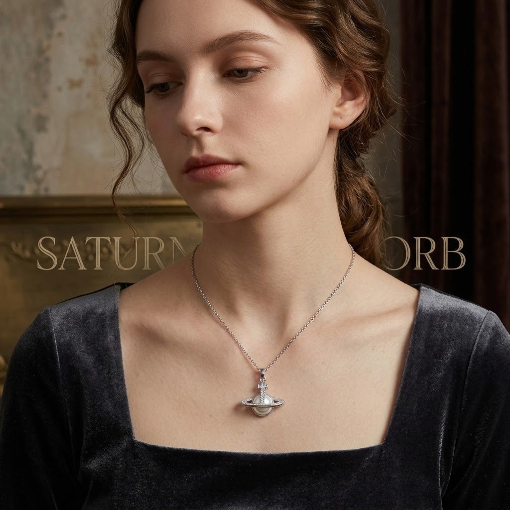 Silver ringed planet pendant necklace with crystal accents, centered at neckline