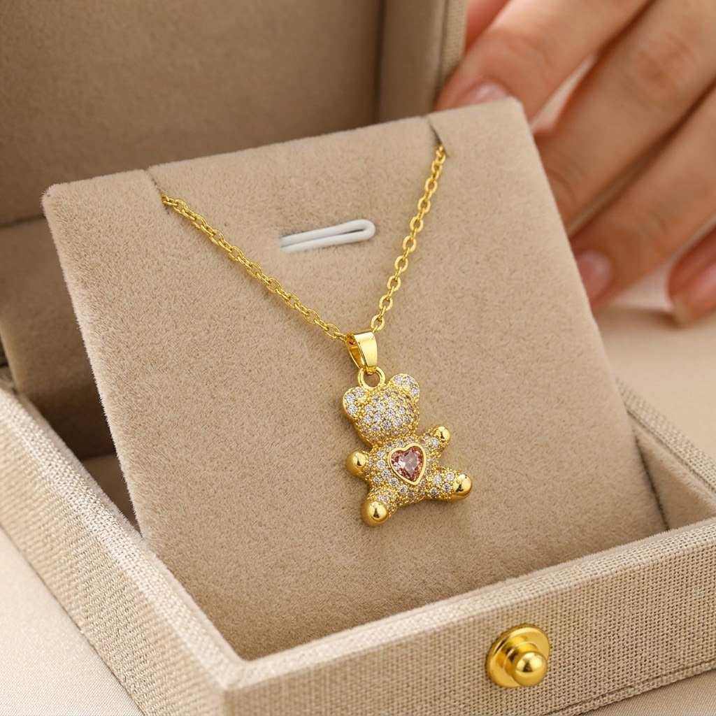 Gold-tone mini bear charm necklace with sparkling bear and heart gem pendant