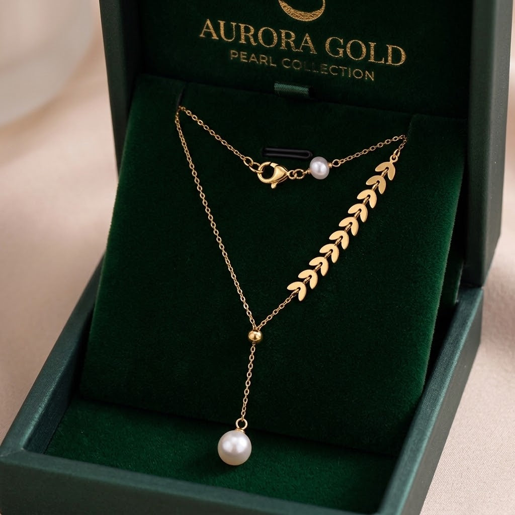 Gold leaf cluster charm necklace with two pearls and a small ring pendant