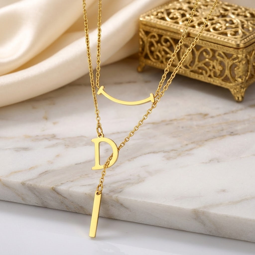 Gold letter D charm necklace with curved bar and D pendant