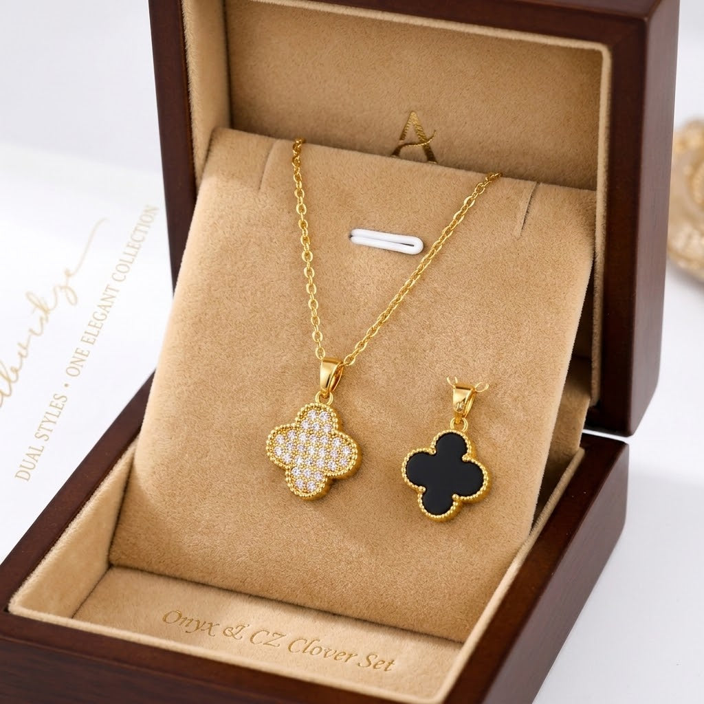Gold clover pendant necklace with pavé floral charm, shown in a gift box with a matching earring