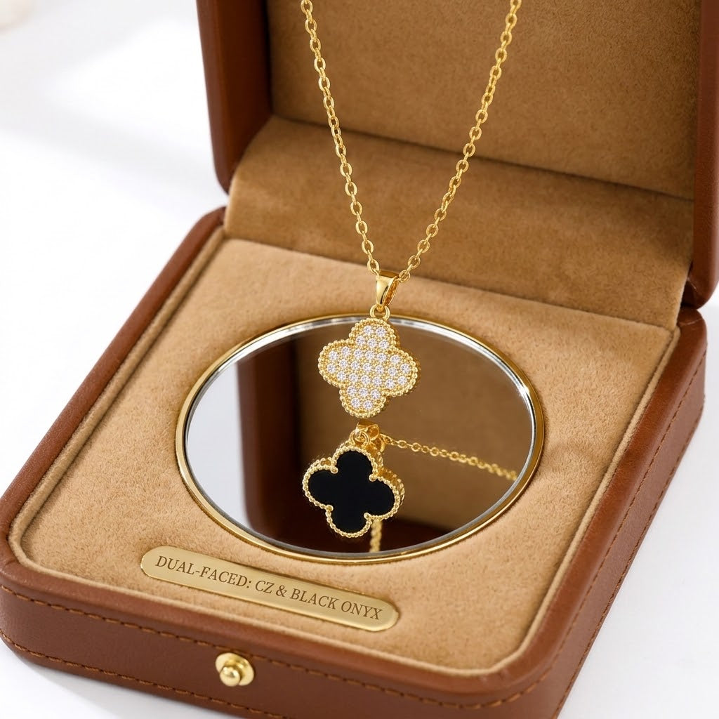 Gold floral pendant necklace with pavé cz and black onyx clover design