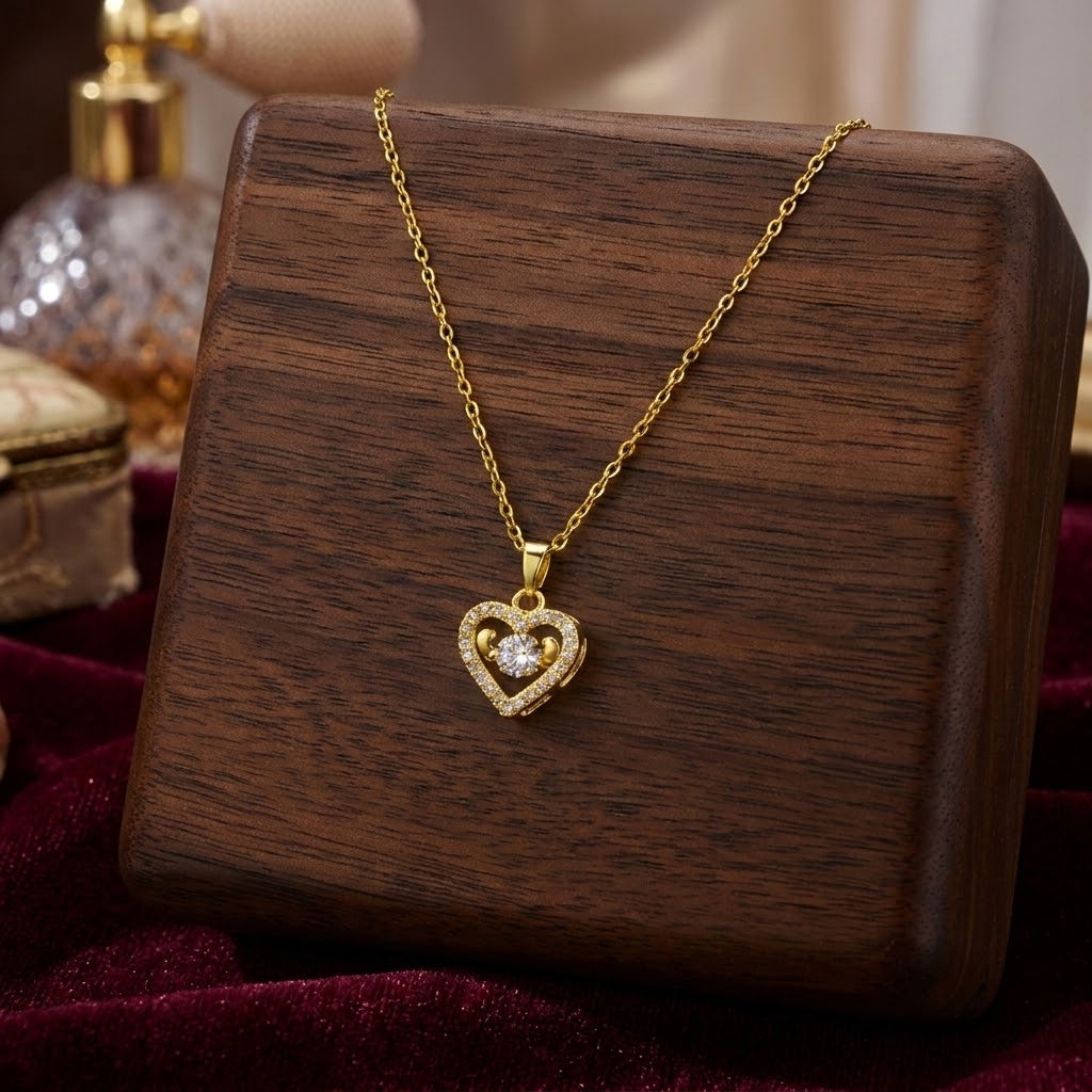Gold-tone mini heart necklace with sparkling heart pendant on a fine chain