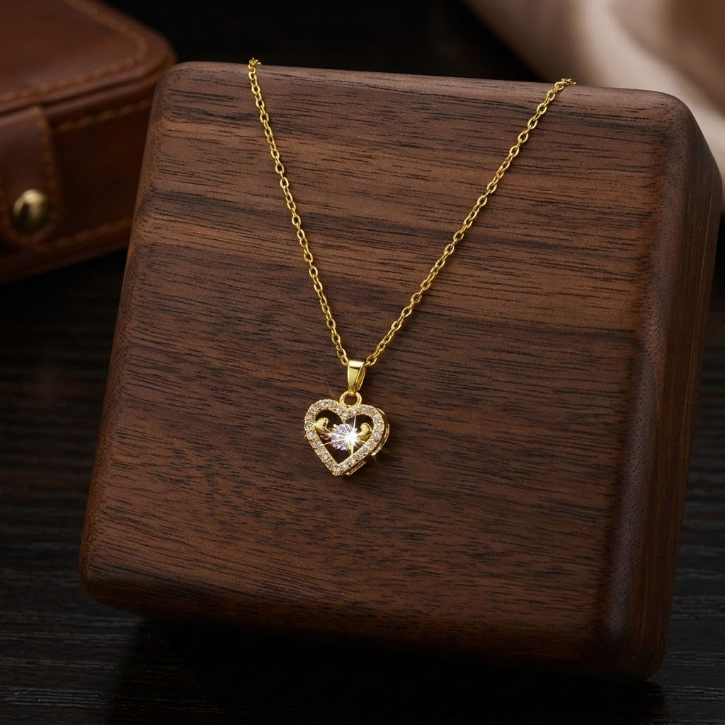 Gold-tone mini heart necklace with small sparkling heart pendant on a chain