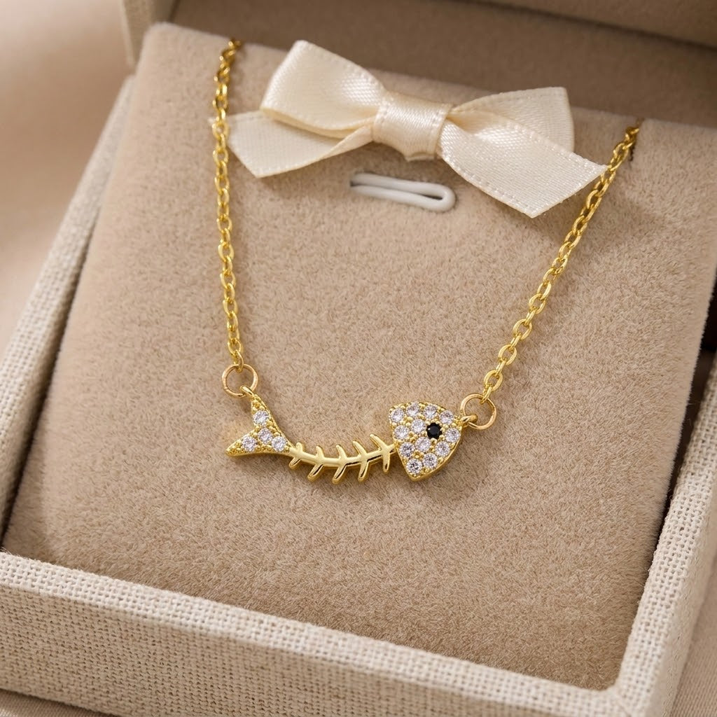 Gold-tone fishbone charm necklace with crystal round pendant
