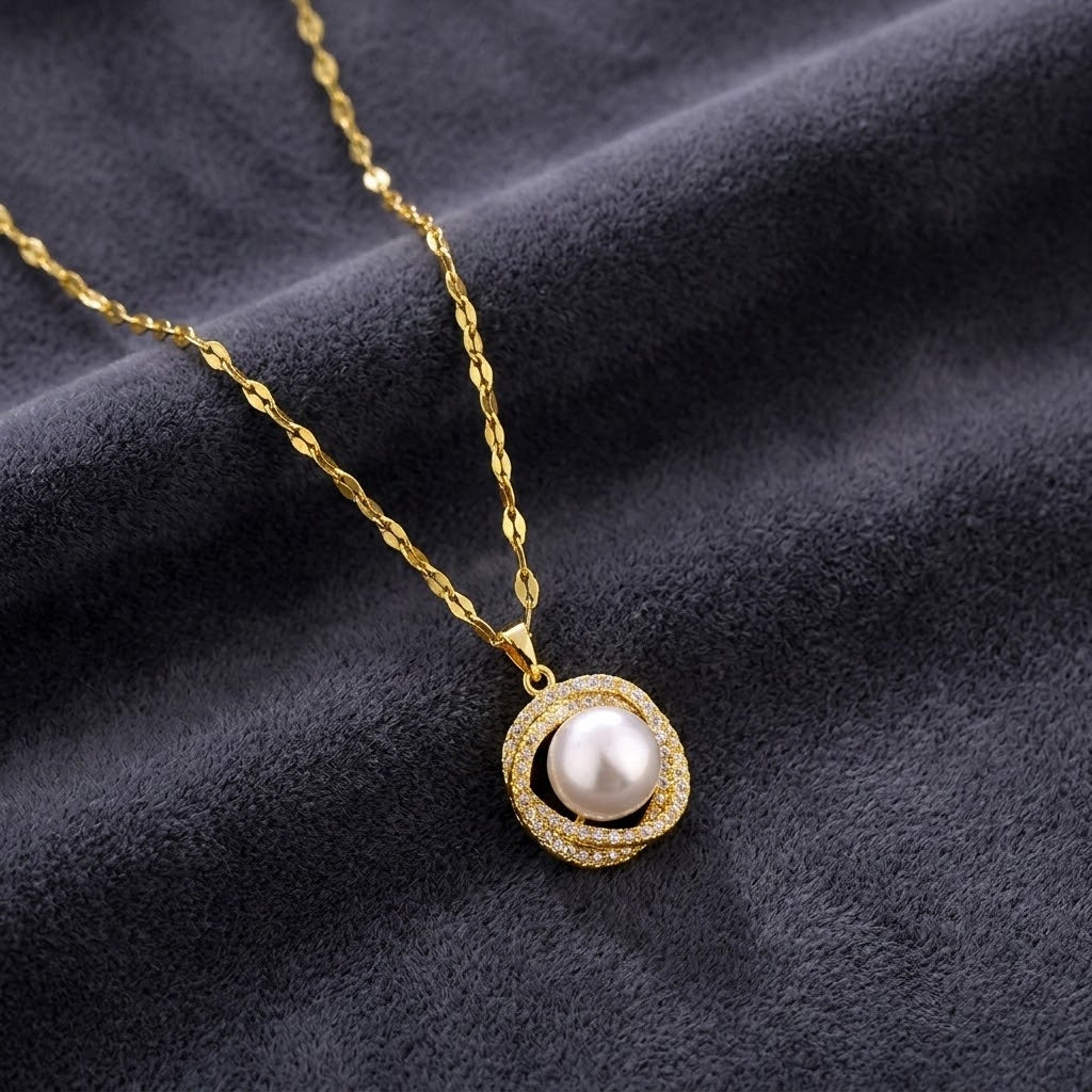 Gold pendant necklace with a white bead charm and rhinestone halo