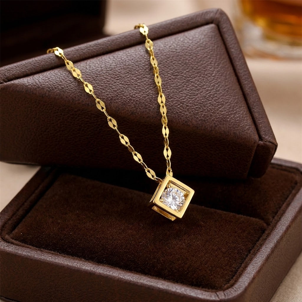 Gold square charm necklace with clear cubic centerpiece on textured link chain