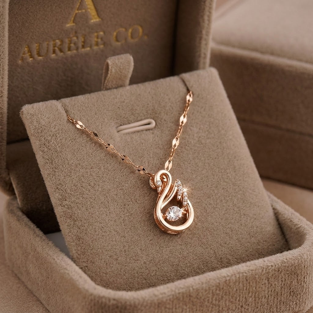 Rose gold swan charm necklace with curved swan pendant and sparkling stone detail