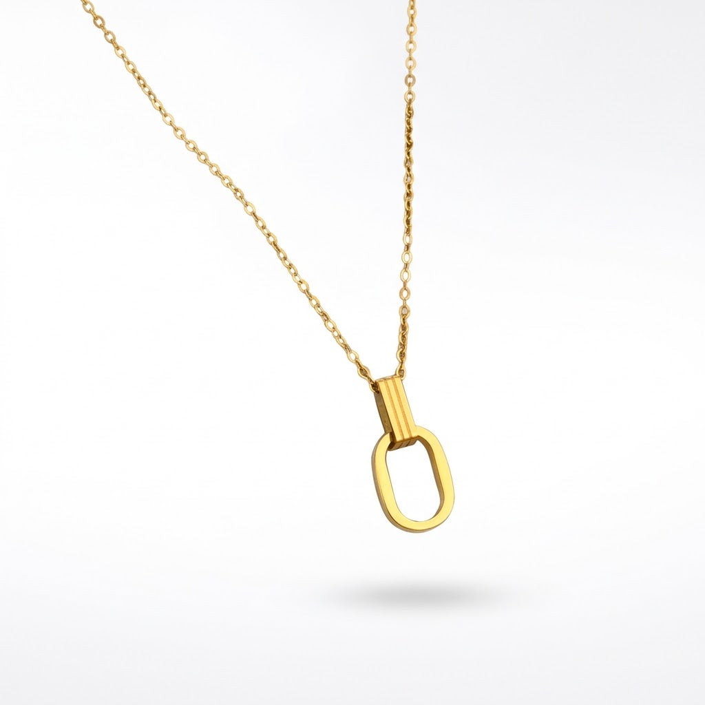 Gold O-shaped charm necklace featuring an open oval pendant on a fine chain