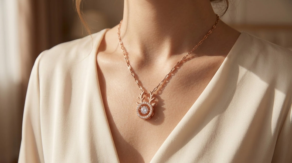 Rose-gold branch charm necklace with round crystal pendant at the neckline